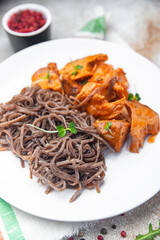 wok noodles soba buckwheat meal tomato sauce meat food snack on the table copy space food background 