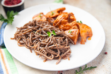 wok noodles soba buckwheat meal tomato sauce meat food snack on the table copy space food background 