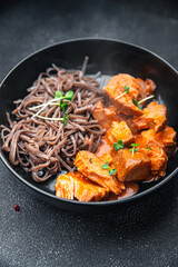 wok noodles soba buckwheat meal tomato sauce meat food snack on the table copy space food background 