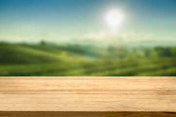 Tea plantation on hill view with empty wooden table top Product display background concept