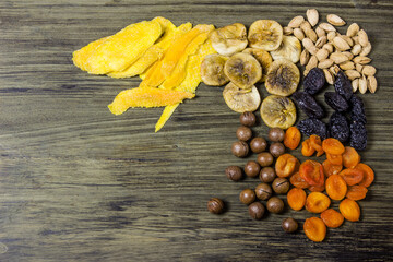 Mixed dried fruits. Symbols of the Jewish holiday Tu Bishvat. Figs, dried apricots, prunes, nuts, almonds, dried mangoes, Mikadamia nuts.
