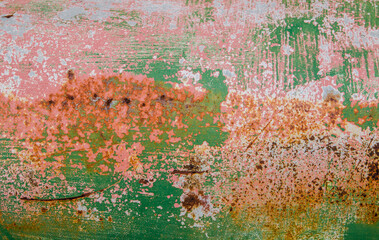 Painted green rusty metal abstract pattern on surface for background.