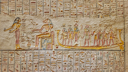 Luxor, Egypt: Corridor with ancient Egyptian inscriptions and hieroglyphs in a tomb.