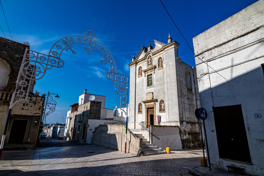 Holiday celebration decorations, San Rocco, Specchia, region of Lecce, Italy. Lovely summer day. Travel street view.