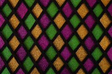 Shiny green, purple and golden glittering paillettes diamonds fabric. Mardi Gras holiday background. © vetre