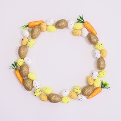 Fototapeta na wymiar Creative frame copy space on white background with eggs and carrots for Easter. Flat lay concept