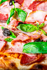 flatbread Pepperoni roman Pizza with Mozzarella cheese, salami, ham, Tomato sauce, olive, pepper, Spices. Italian pizza 
