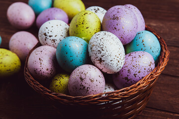 Hand painted pastel colored Easter eggs background. Happy Easter greeting card or invitation.