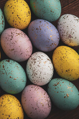 Hand painted pastel colored Easter eggs background. Happy Easter greeting card or invitation.