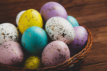 Hand painted pastel colored Easter eggs background. Happy Easter greeting card or invitation.