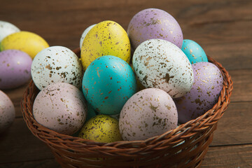 Hand painted pastel colored Easter eggs background. Happy Easter greeting card or invitation.