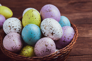 Hand painted pastel colored Easter eggs background. Happy Easter greeting card or invitation.