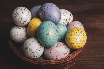 Hand painted pastel colored Easter eggs background. Happy Easter greeting card or invitation.