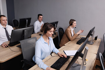 Call center operators working in modern office