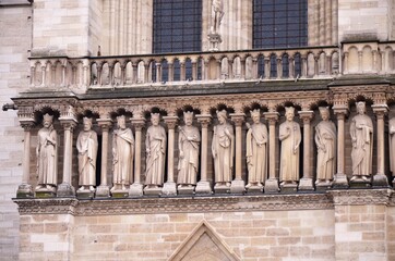 Paris, France - famous Notre Dame cathedral facade saint statues. UNESCO World Heritage Site