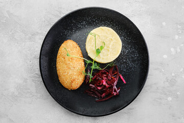 Kiev citlet with mashed potato and pickled beetroot, top view