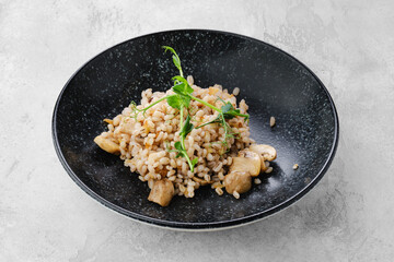 Boilet pearl barley with fried champignons
