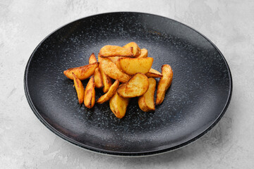 Slices of potato wedges fried in oil