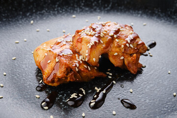 Fried chicken meat with teriyaki sauce, closeup view © boomeart