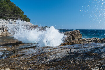 Waves crushing on a rocky beach on Saint Marguerite Island, In front of Cannes, Lerins Islands South of France