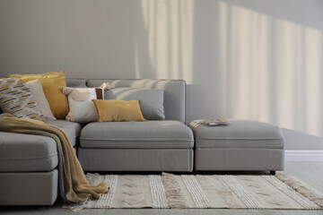 Living room interior with large grey sofa