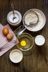Dough for cooking pancakes on kefir. Eggs, flour, a glass of kefir, sugar, salt. Country style.