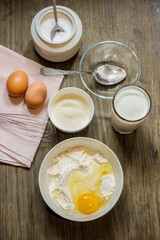 Dough for cooking pancakes on kefir. Eggs, flour, a glass of kefir, sugar, salt. Country style.