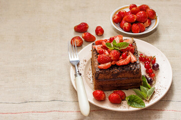 Homemade baking. Chocolate cake with strawberries and mint.