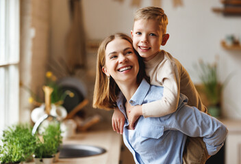 Mother playing with son in kitchen