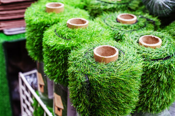 Artificial turf in rolls. Trade in floor coverings in a wholesale and retail network. Close-up