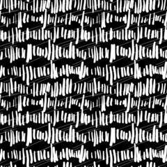 Abstract black and white doodle seamless pattern. Vertical and diagonal white hatching on black background