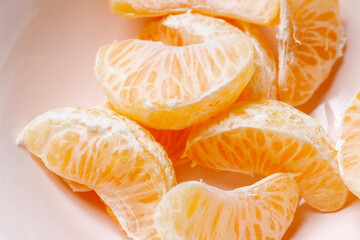 A pieces of tangerine in a bowl.