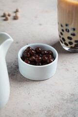 Tapioca pearls in white bowl for cooking bubble tea.
