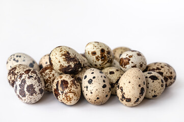 quail eggs on white background. Close-up. The idea of healthy breakfast, symbol of Easter. Copy space