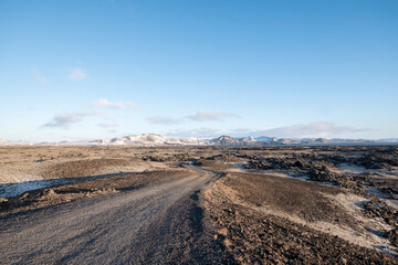 Driveway through a lava field at the Hopsnesviti lighthouse near Grindavik