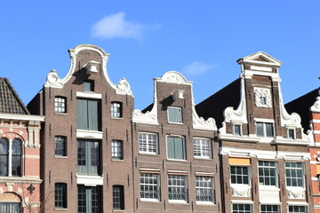 Fototapeta na wymiar Amsterdam Oude Turfmarkt Street Historic House Facades with Bell and Neck Gables, Netherlands