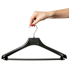 female hand holds a black clothes hanger on a white isolated background. hanger on white background