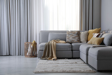 Living room interior with large grey sofa