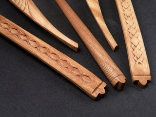 handmade wooden spoons on a dark background