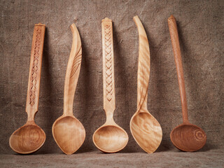 handmade wooden spoons on a dark background