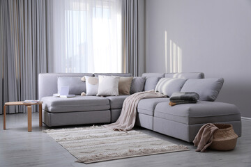 Living room interior with large grey sofa