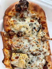 Mushroom and artichoke sliced flatbread