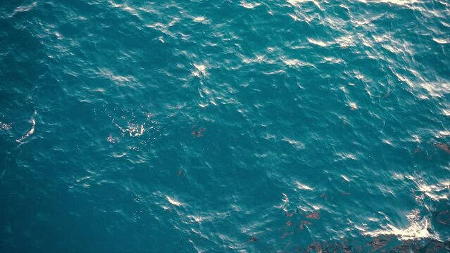 Slow motion over disturbed ocean water surface, loopable. Impressive background for movie credits or intro	
