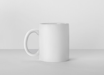 Blank ceramic mug on white background. Mockup for design