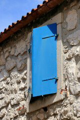 blue window in the ancient hill town Lubenice, island Cres, Croatia