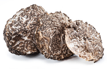 Black truffle slices on white background. The most famous of the trufflez.