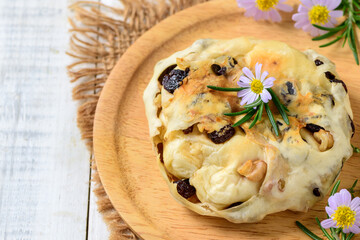 Walnut Raisin Bread Filled with Cream Cheese and decorate  with flowers and rosemary leaves