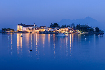 Obraz premium Panoramic view of Lago Maggiore lake at night, Italy
