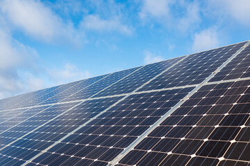 Solar panel of a solar farm. Photovoltaic modules of a Solar energy power plant producing sustainable energy to prevent climate change.