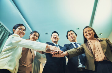 Obraz premium Asian Business working team join hand together for working,selecive focus on hands
